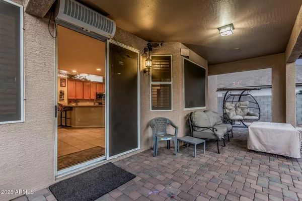 a front view of a house with plants