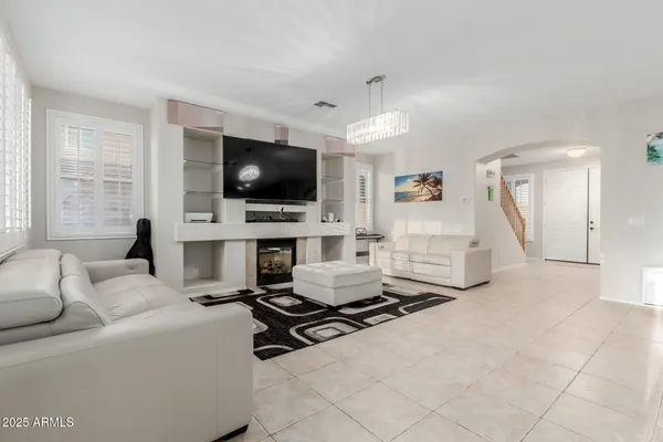 a living room with furniture and a table