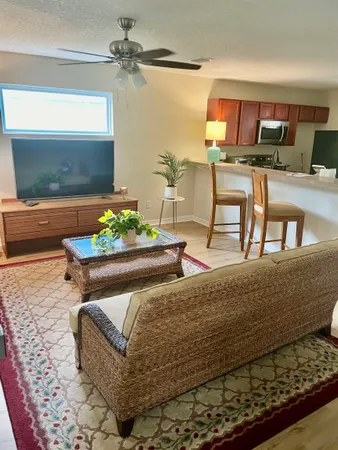 a living room with furniture and a table