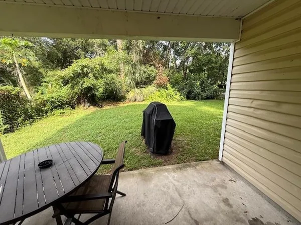 a view of backyard with seating space