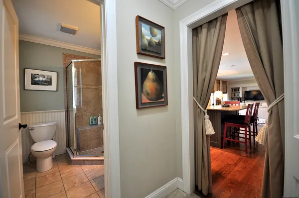 a view of a hallway with furniture and a gate
