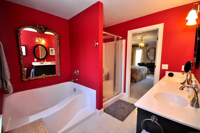 a en suite bathroom with a sink and a mirror