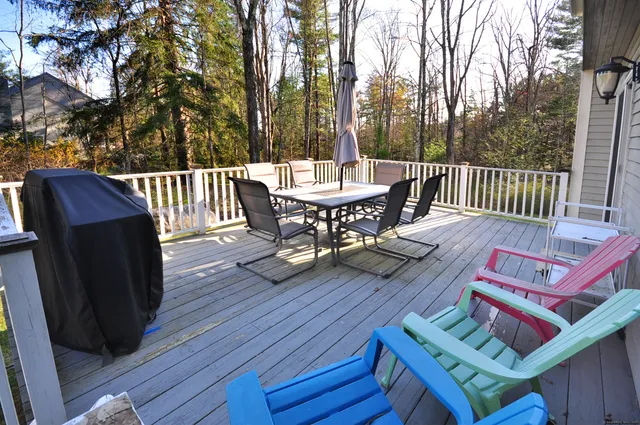 a view of a chairs and table on the deck