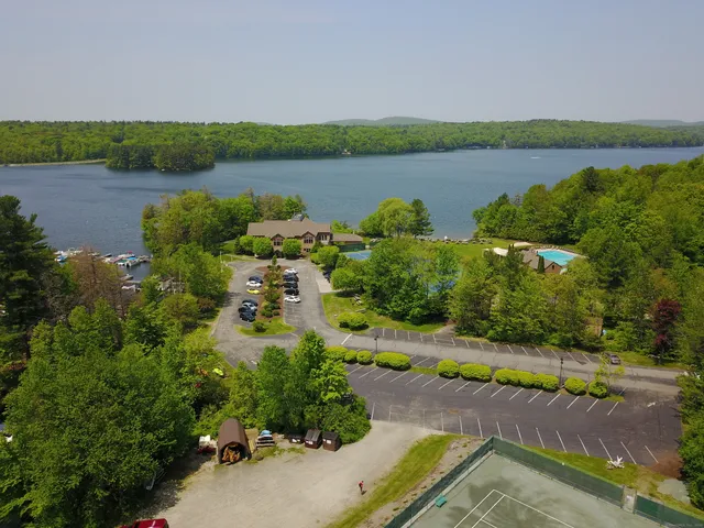 a view of a lake with a yard and lake view