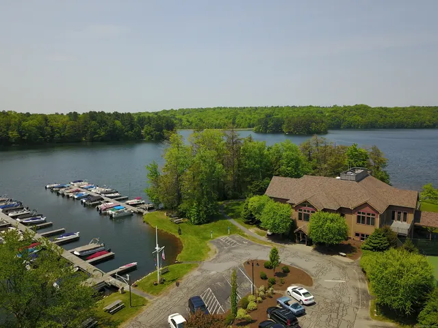 an aerial view of a house with a lake view