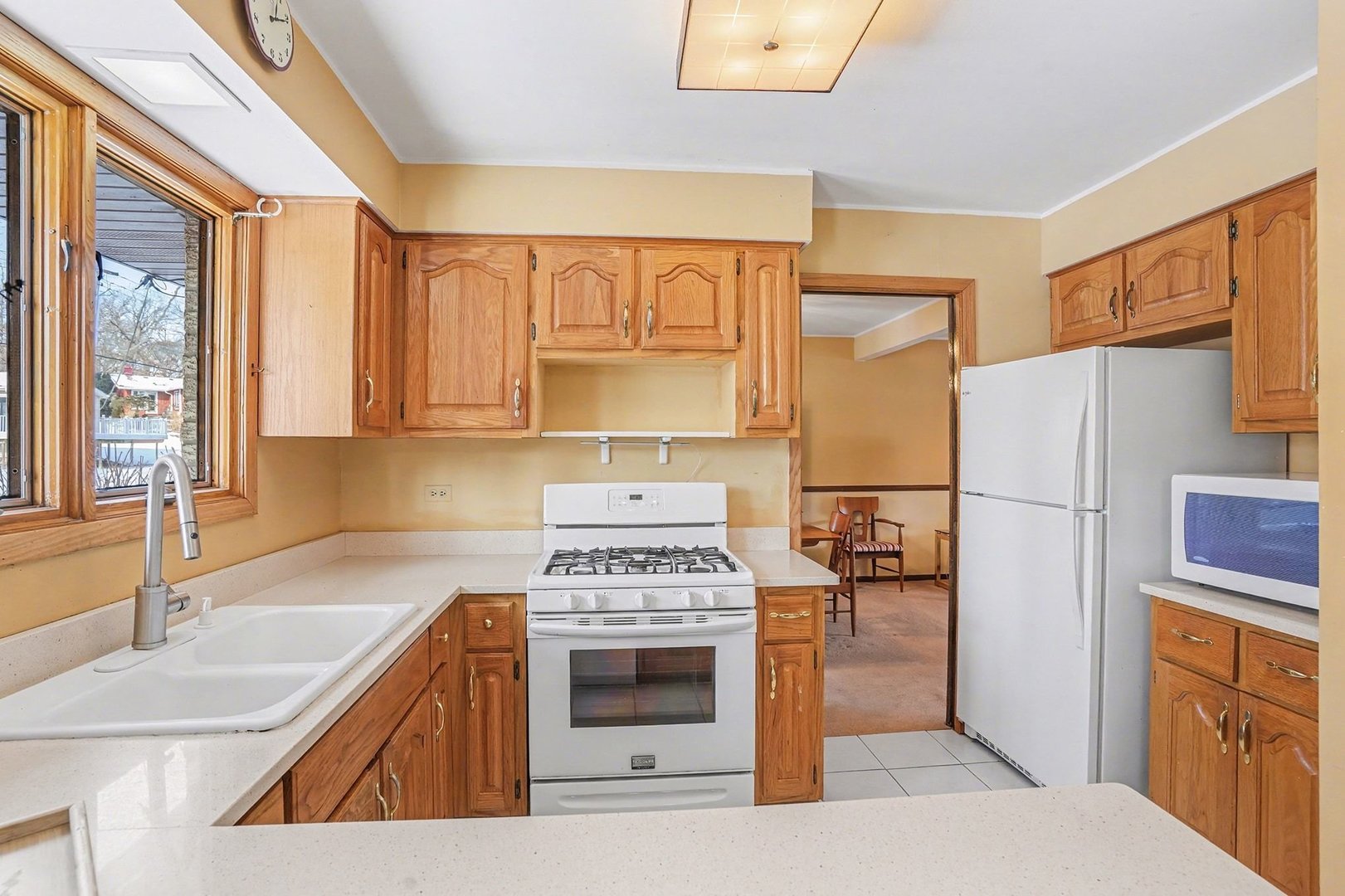 14550 Raneys Lane Orland Park, IL 60462 - Photo 9 of 27 a kitchen with stainless steel appliances a stove a sink and a refrigerator