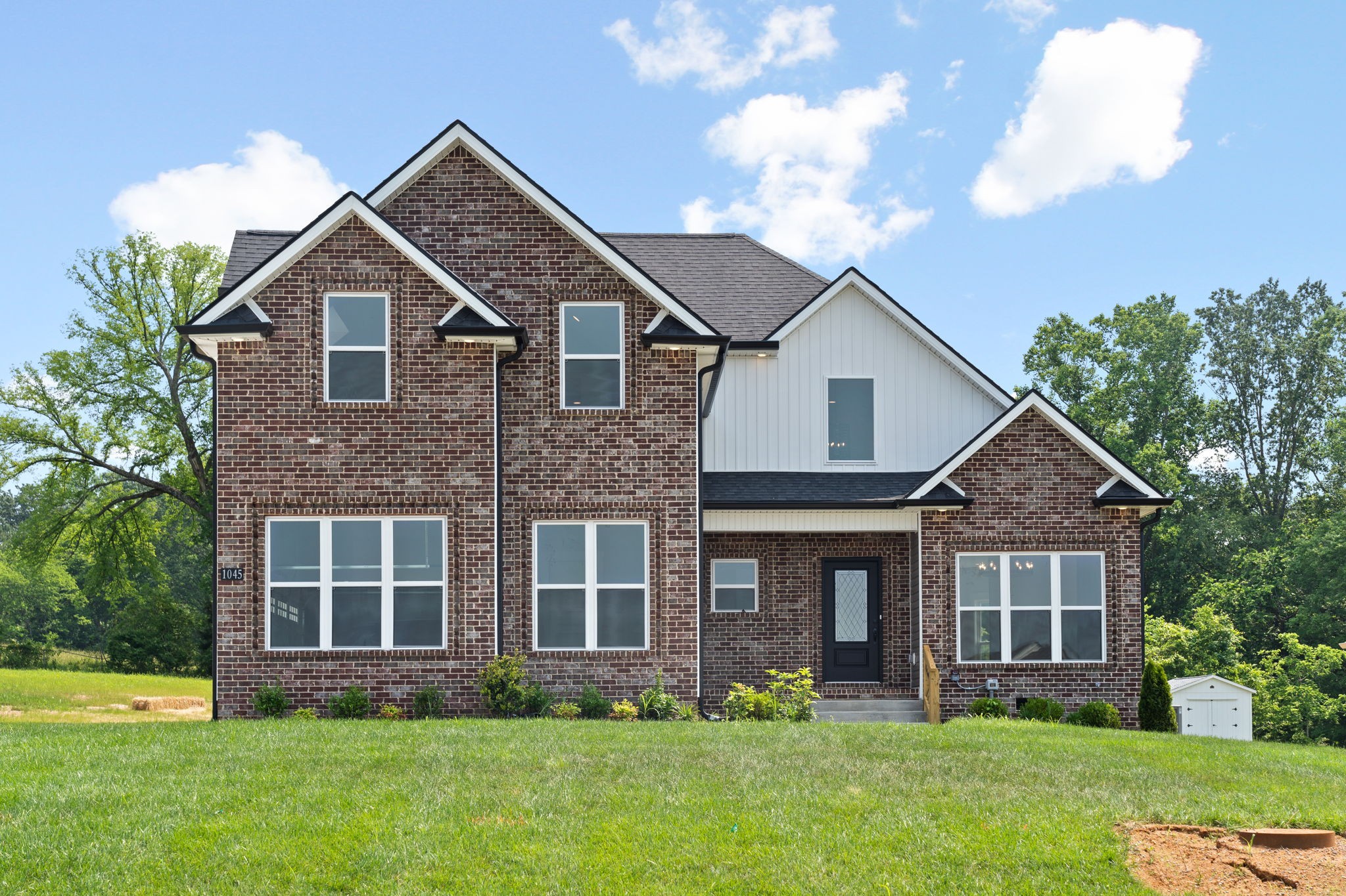1045 Gratton Road Clarksville, TN 37043 - Photo 1 of 38 a front view of a house with garden and porch