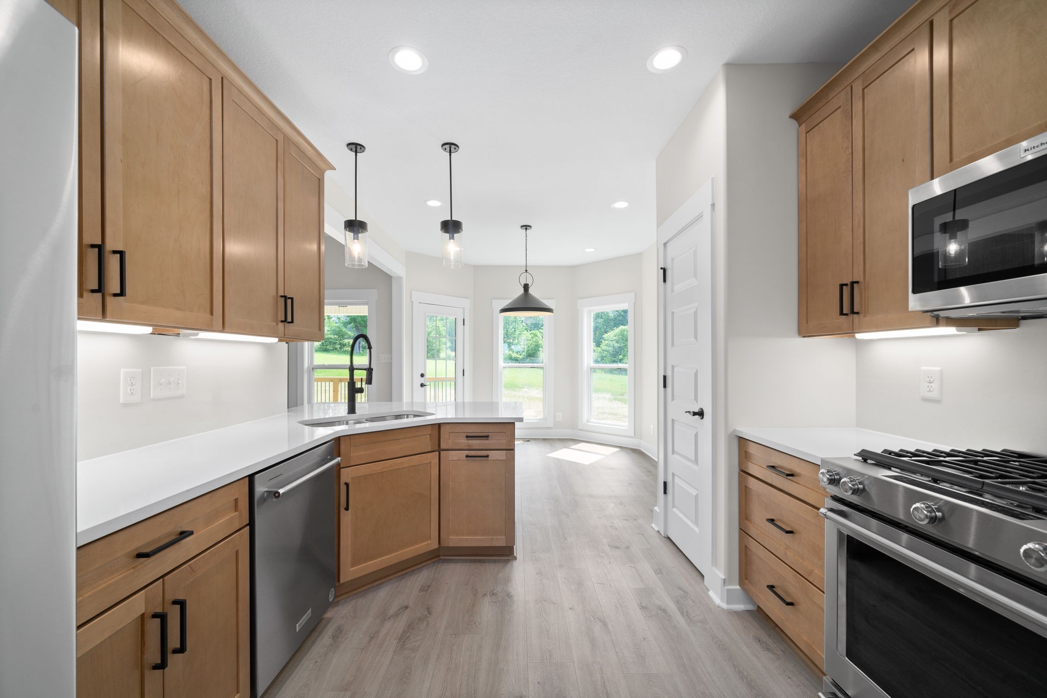 1045 Gratton Road Clarksville, TN 37043 - Photo 11 of 38 a kitchen with a sink stove top oven and cabinets