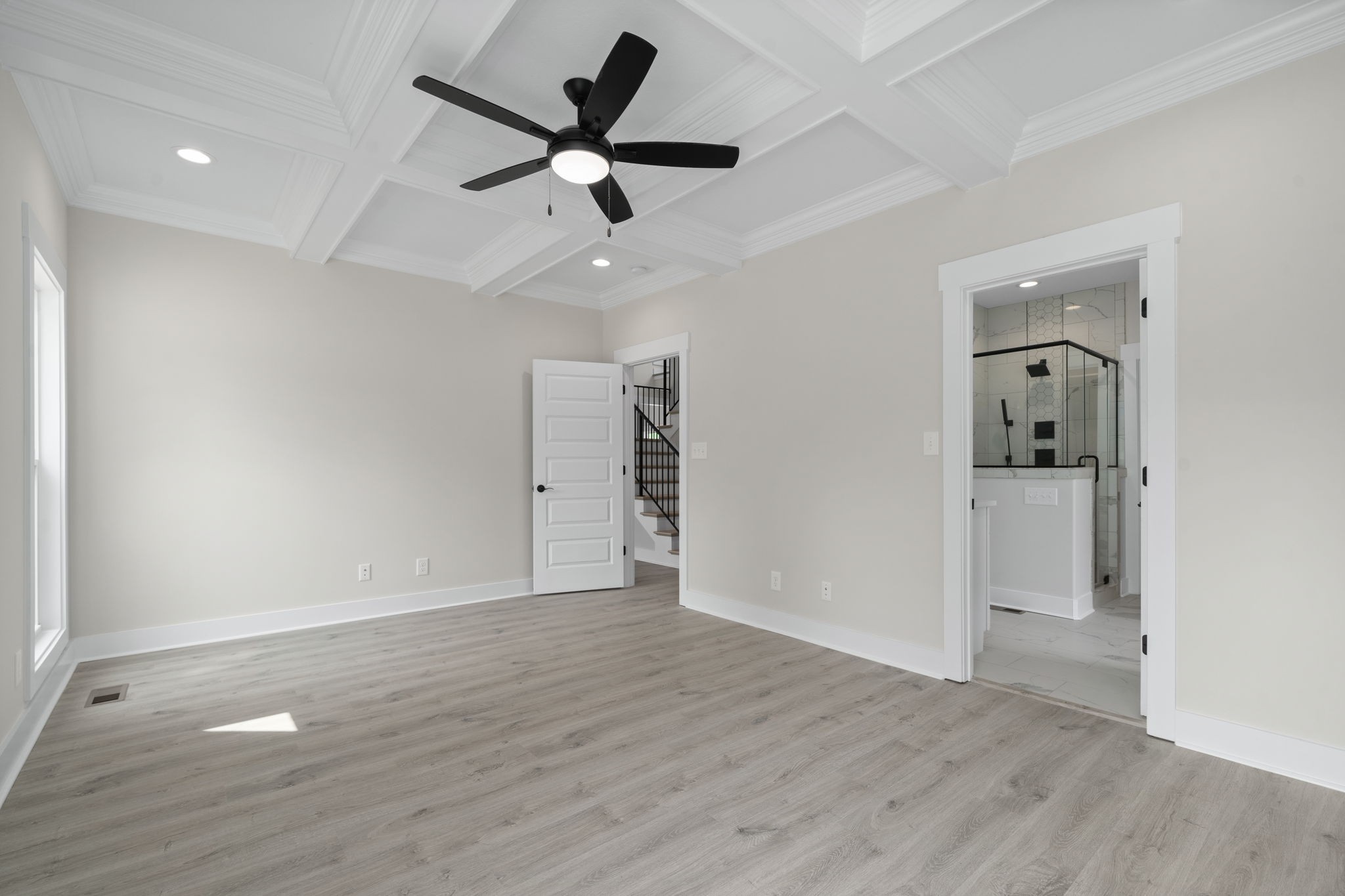 1045 Gratton Road Clarksville, TN 37043 - Photo 18 of 38 an empty room with wooden floor and windows