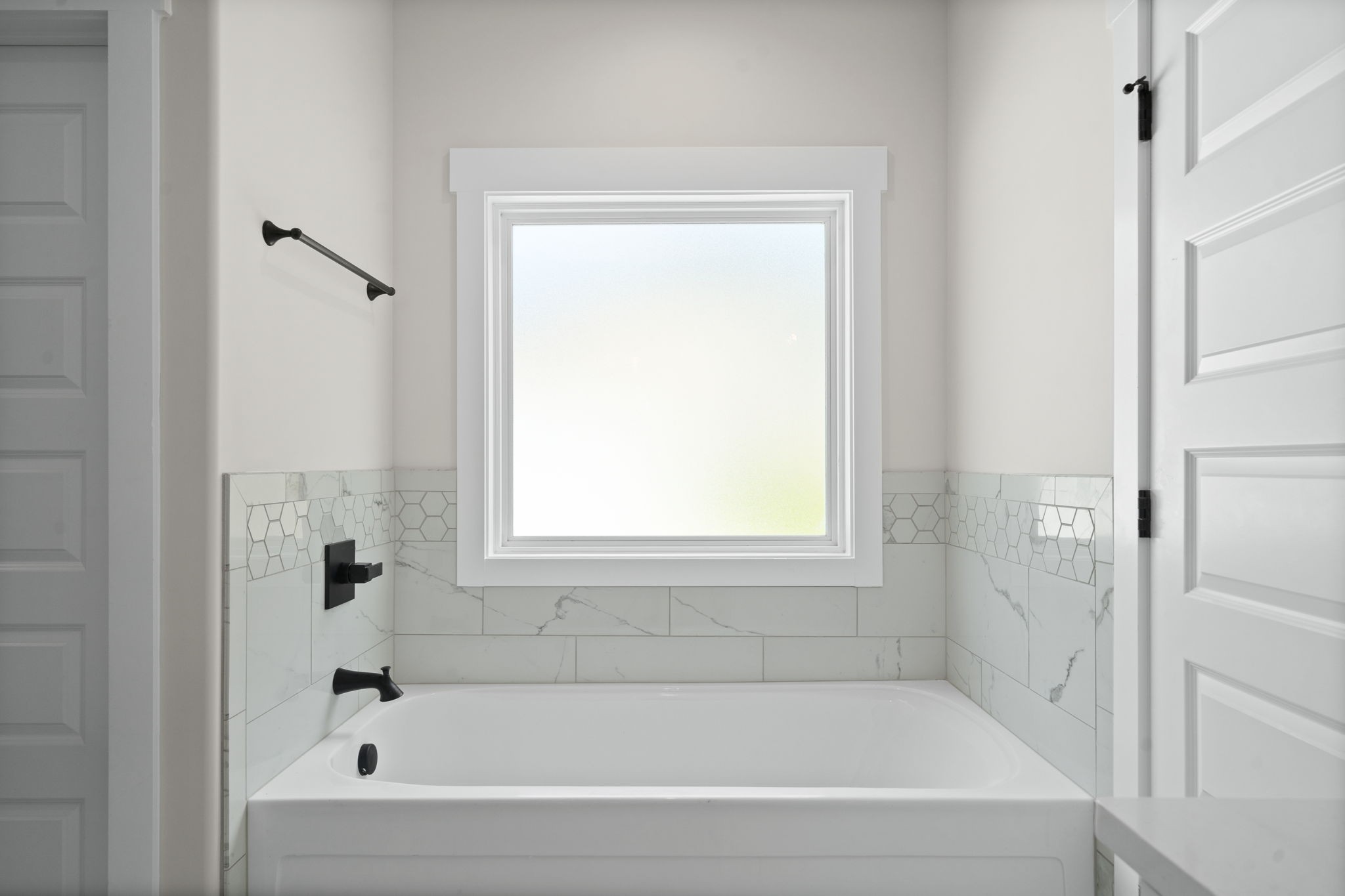 1045 Gratton Road Clarksville, TN 37043 - Photo 20 of 38 a white bath tub sitting next to a window