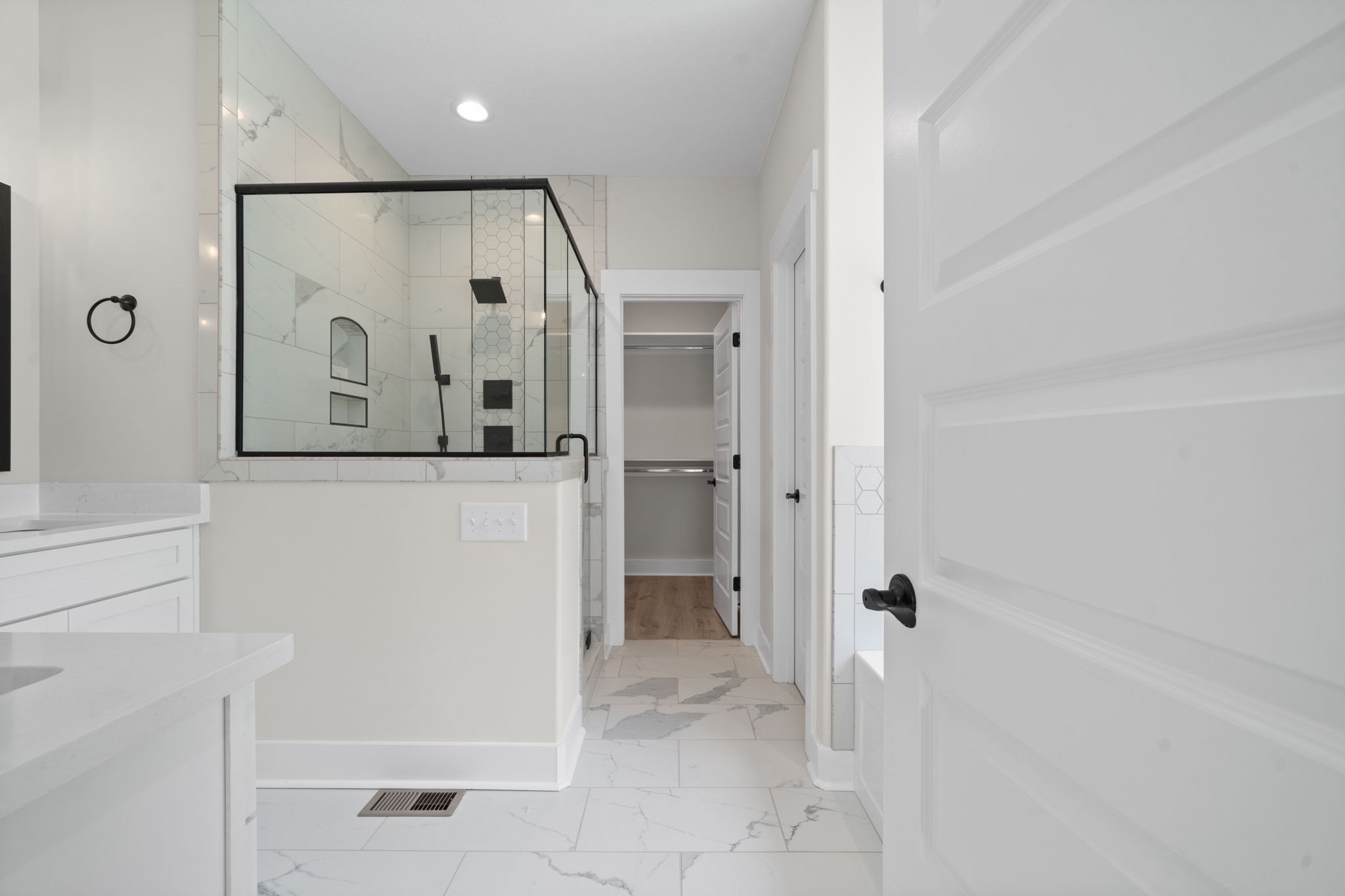 1045 Gratton Road Clarksville, TN 37043 - Photo 22 of 38 a bathroom with a glass shower door and a sink