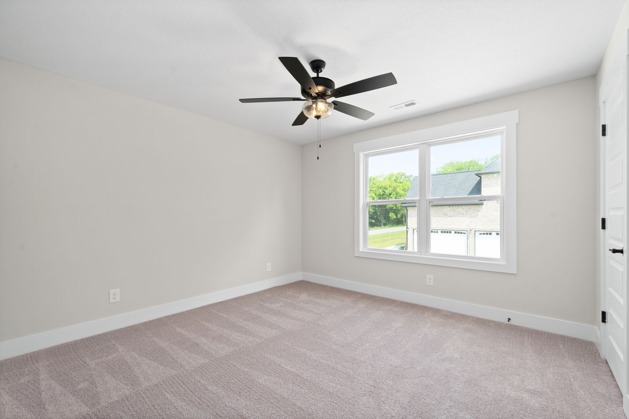 1045 Gratton Road Clarksville, TN 37043 - Photo 28 of 38 an empty room with a window and a fan