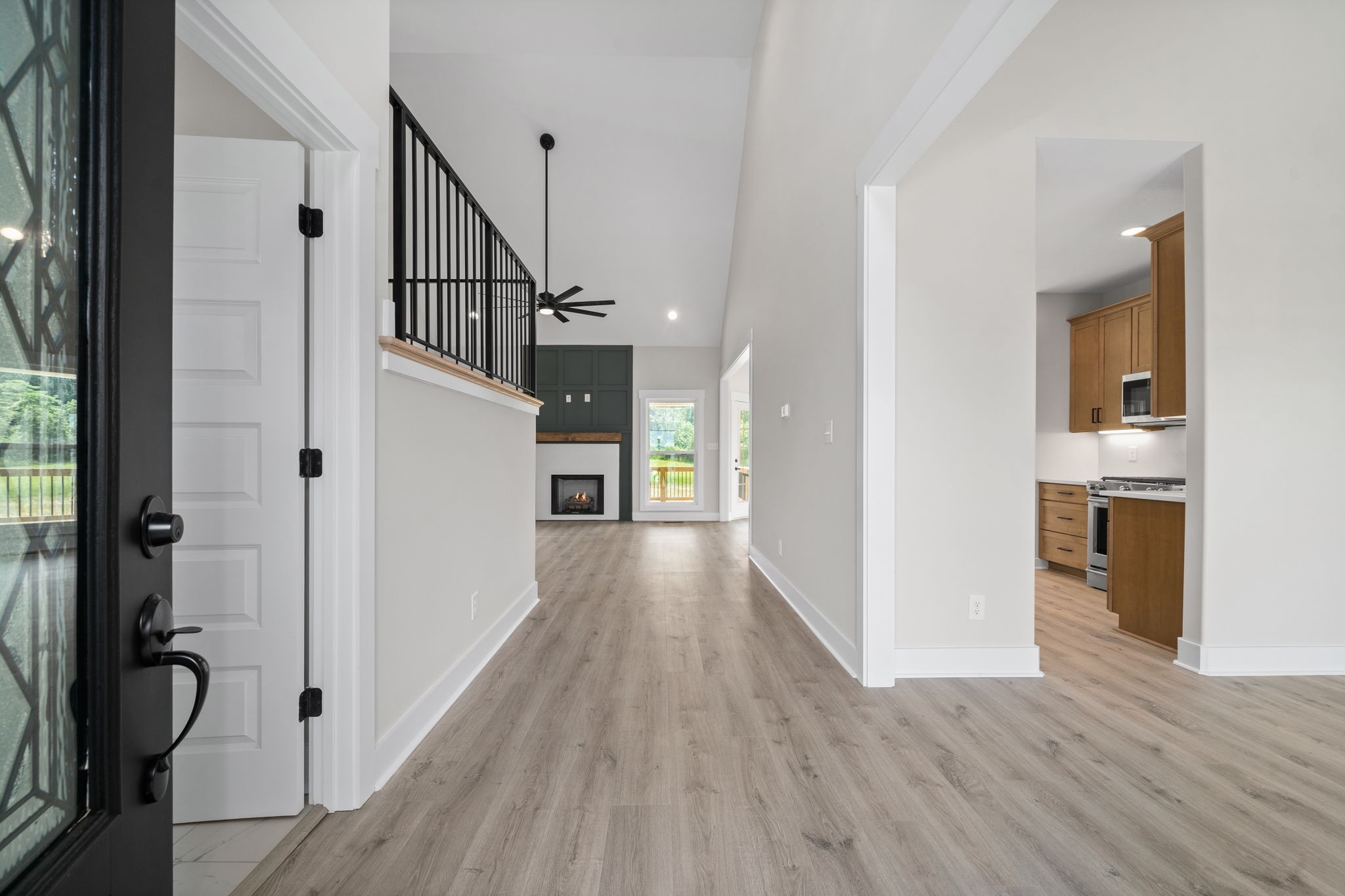 1045 Gratton Road Clarksville, TN 37043 - Photo 3 of 38 a view of a hallway with wooden floor and staircase