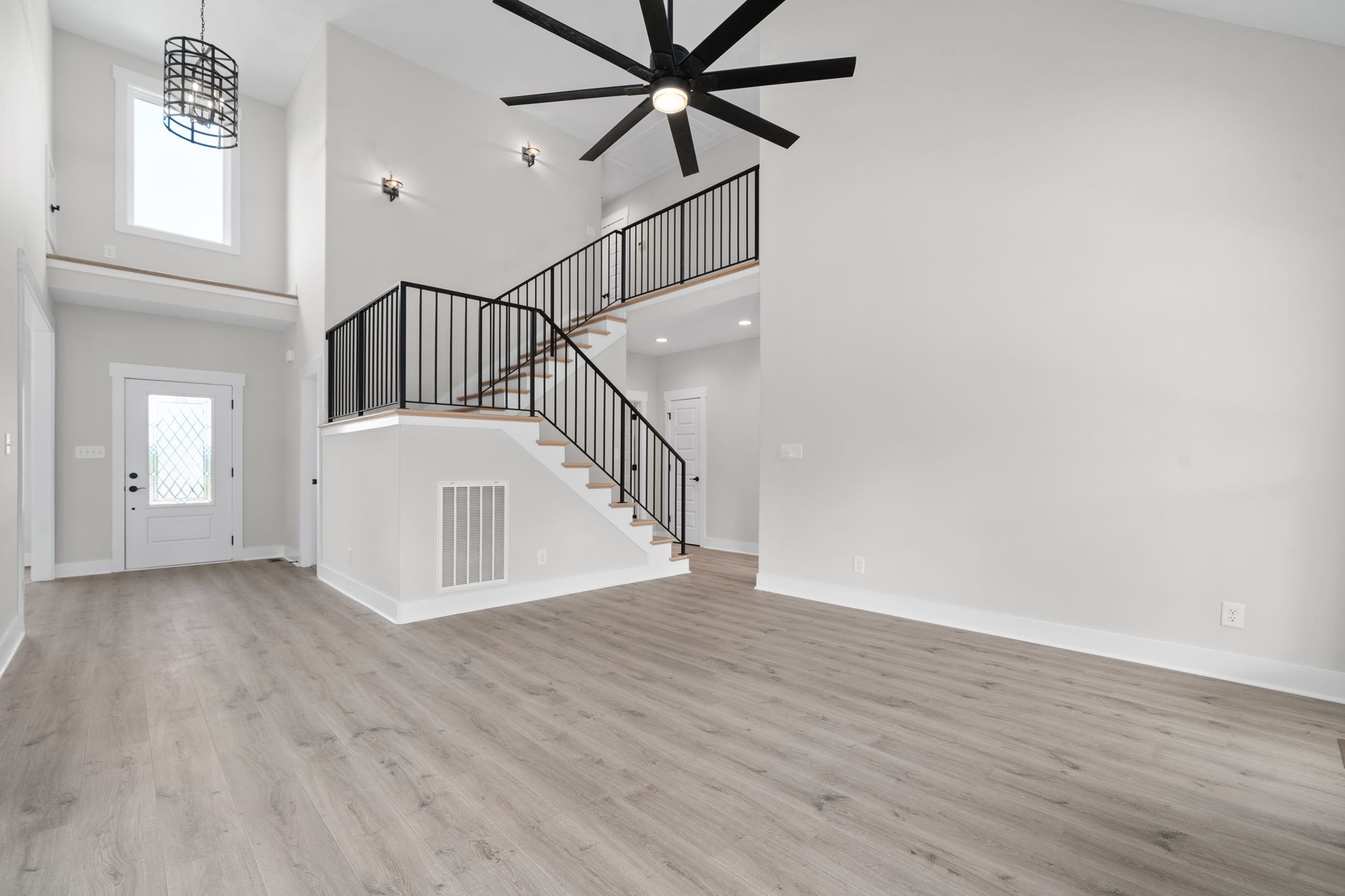 1045 Gratton Road Clarksville, TN 37043 - Photo 5 of 38 a view of a hallway with wooden floor and front door