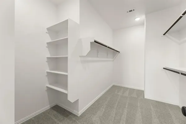 a view of an empty walk in closet