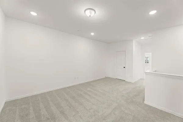 an empty room with a empty space and window