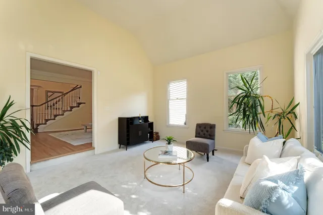 a living room with fireplace furniture and a flat screen tv