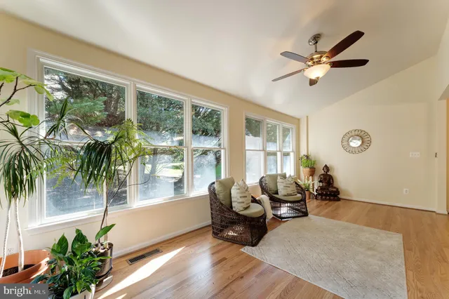 a bed room with furniture and a window