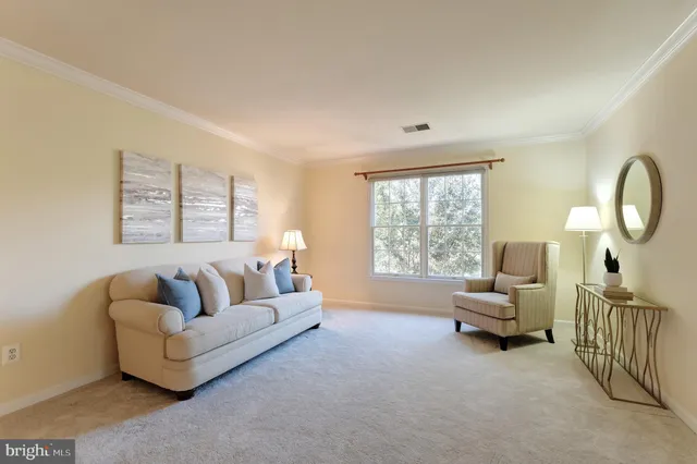 a bedroom with a bed and a lamp