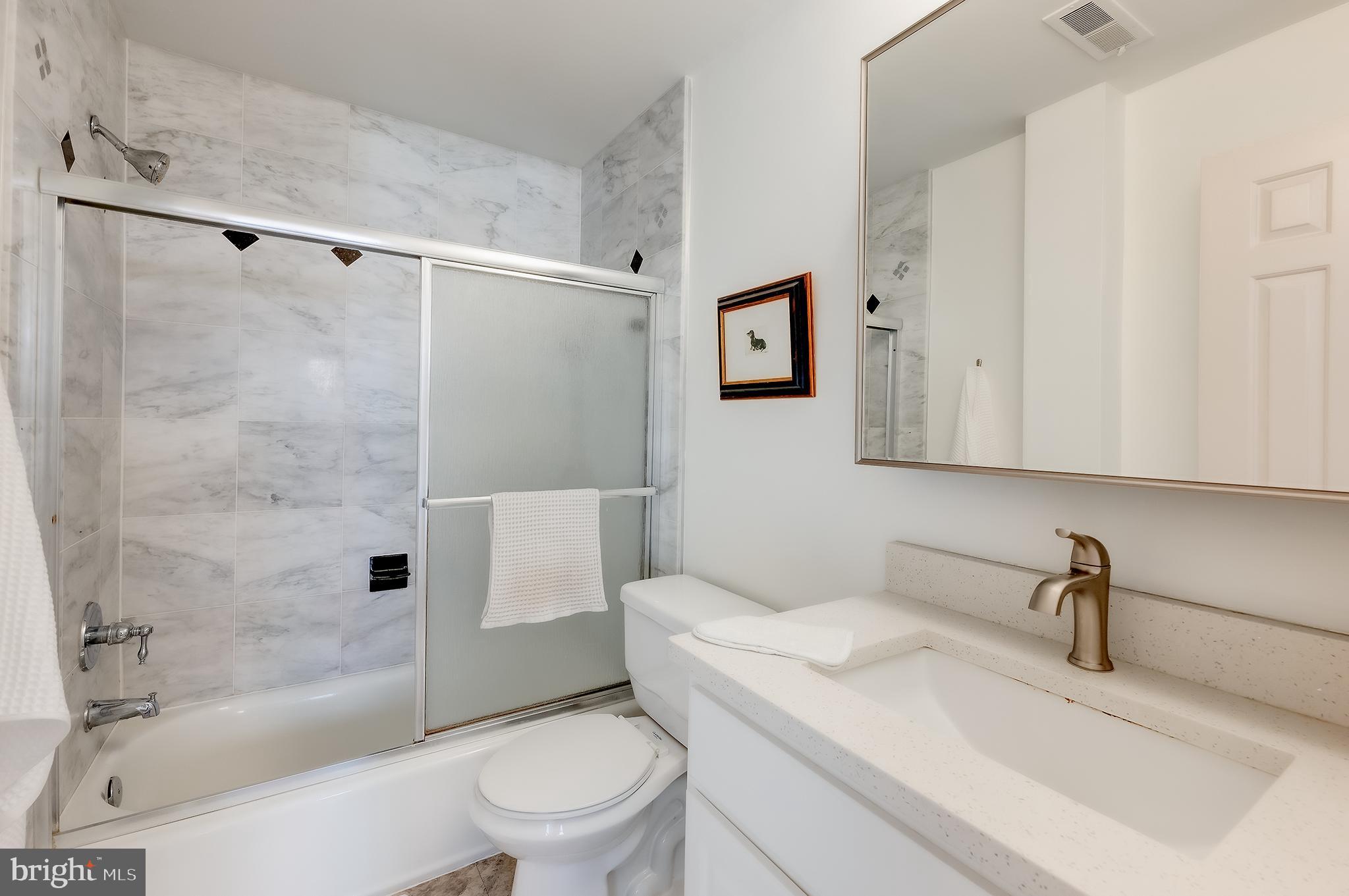1918 18th Street Northwest, Unit 42 Washington, DC 20009 - Photo 15 of 22 a bathroom with a sink toilet and shower