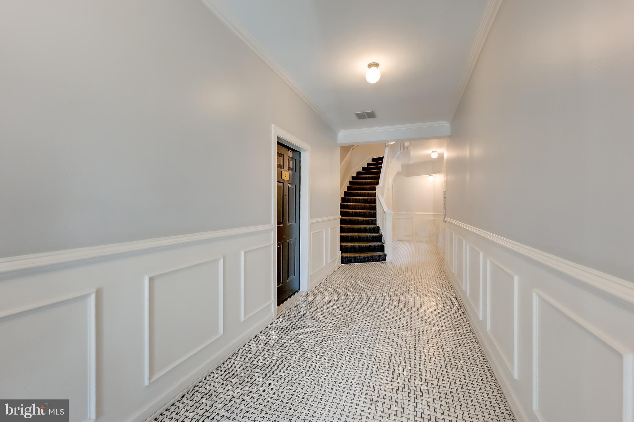 1918 18th Street Northwest, Unit 42 Washington, DC 20009 - Photo 16 of 22 a view of a hallway with stairs
