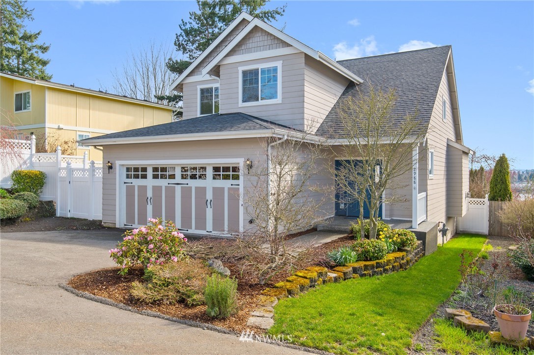 a front view of a house with a yard and porch