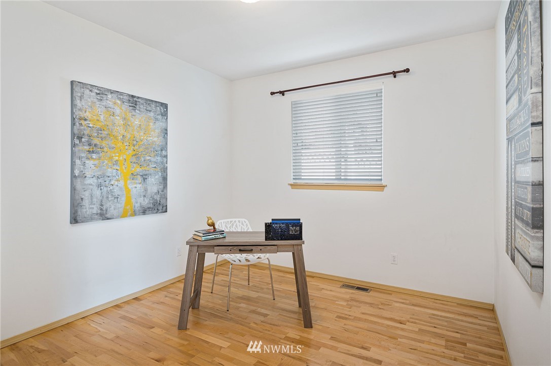 2988 Rickey Road Bremerton, WA 98310 - Photo 14 of 34 a workspace room with wooden floor and a window