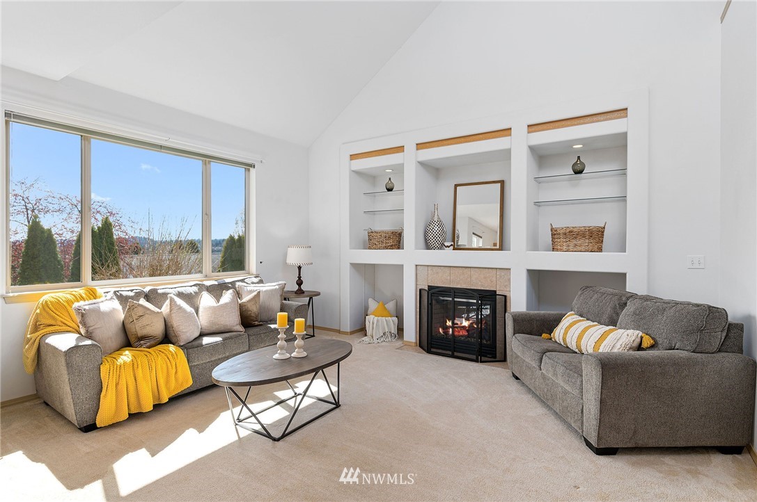 2988 Rickey Road Bremerton, WA 98310 - Photo 5 of 34 a living room with furniture fireplace and a large window