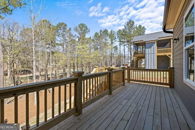 a view of a balcony with wooden floor