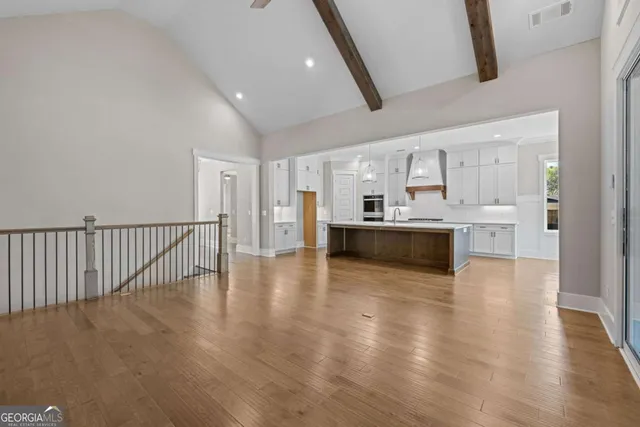 a view of kitchen with wooden floor