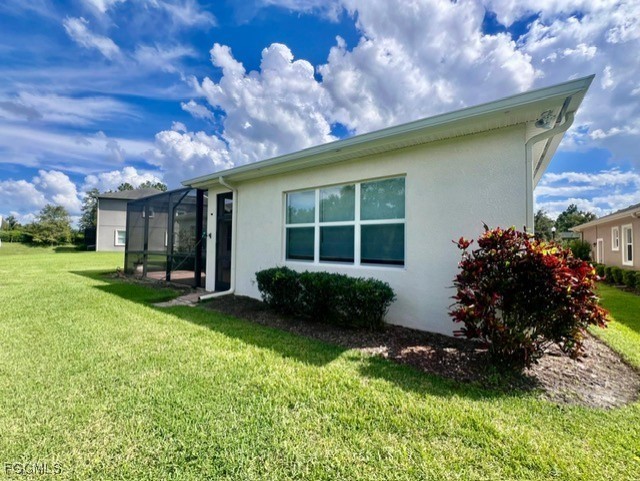 7121 Hatpin Loop Wesley Chapel, FL 33545 - Photo 24 of 24 a house view with a garden space