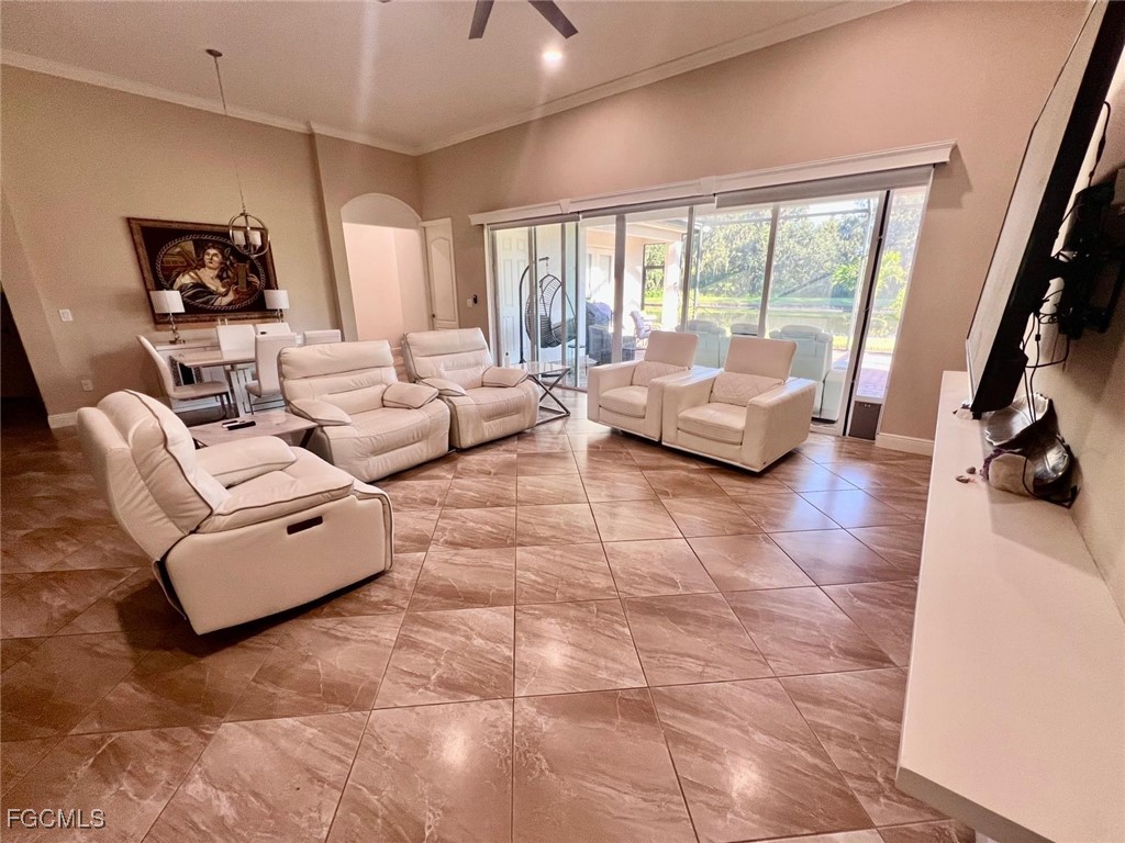 7121 Hatpin Loop Wesley Chapel, FL 33545 - Photo 4 of 24 a living room with furniture and a large window