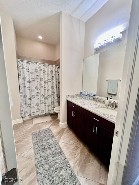 7121 Hatpin Loop Wesley Chapel, FL 33545 - Photo 10 of 24 a spacious bathroom with a double vanity sink a mirror and a shower