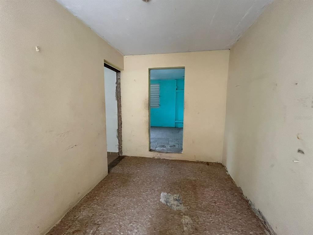 5 Calle Barceloneta, PR 00617 - Photo 17 of 40 an empty room with closet