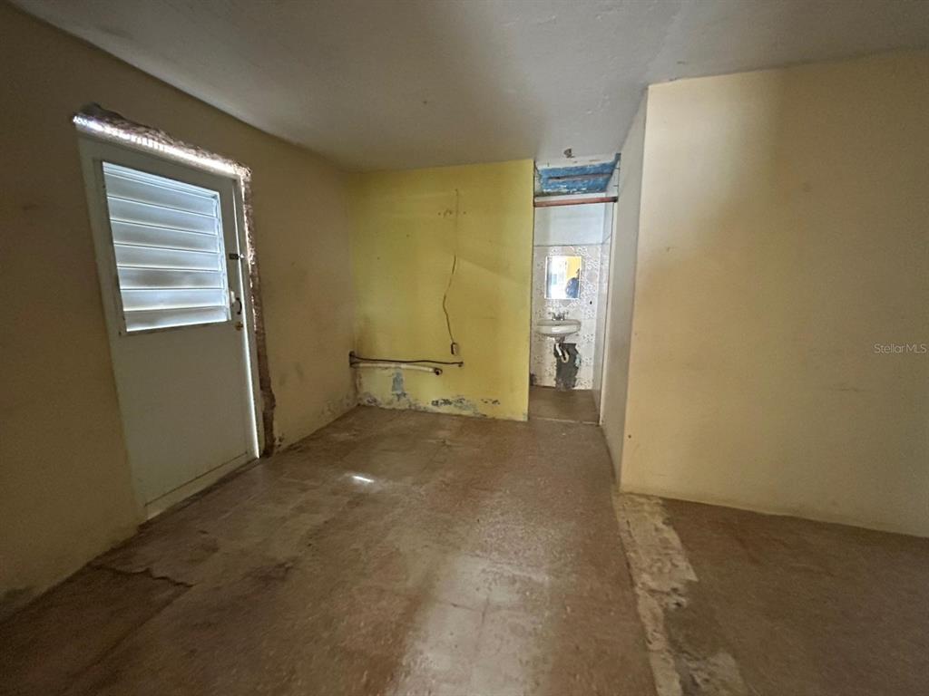 5 Calle Barceloneta, PR 00617 - Photo 31 of 40 a view of a room with an empty space and a window