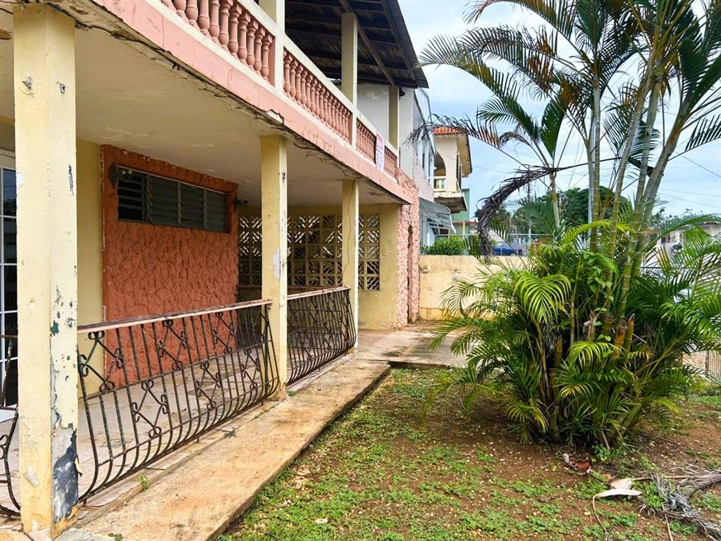 5 Calle Barceloneta, PR 00617 - Photo 32 of 40 a view of a house with a small yard