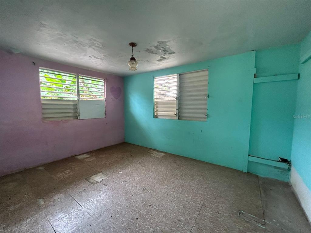 5 Calle Barceloneta, PR 00617 - Photo 35 of 40 an empty room with windows