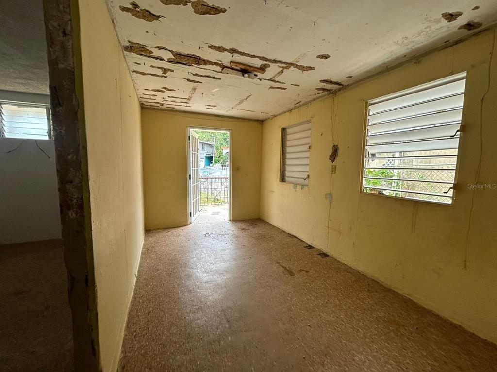 5 Calle Barceloneta, PR 00617 - Photo 6 of 40 a view of a hallway with a wooden floor