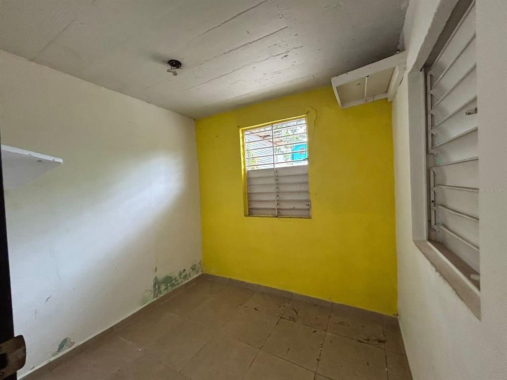 5 Calle Barceloneta, PR 00617 - Photo 7 of 40 a view of a yellow room with windows