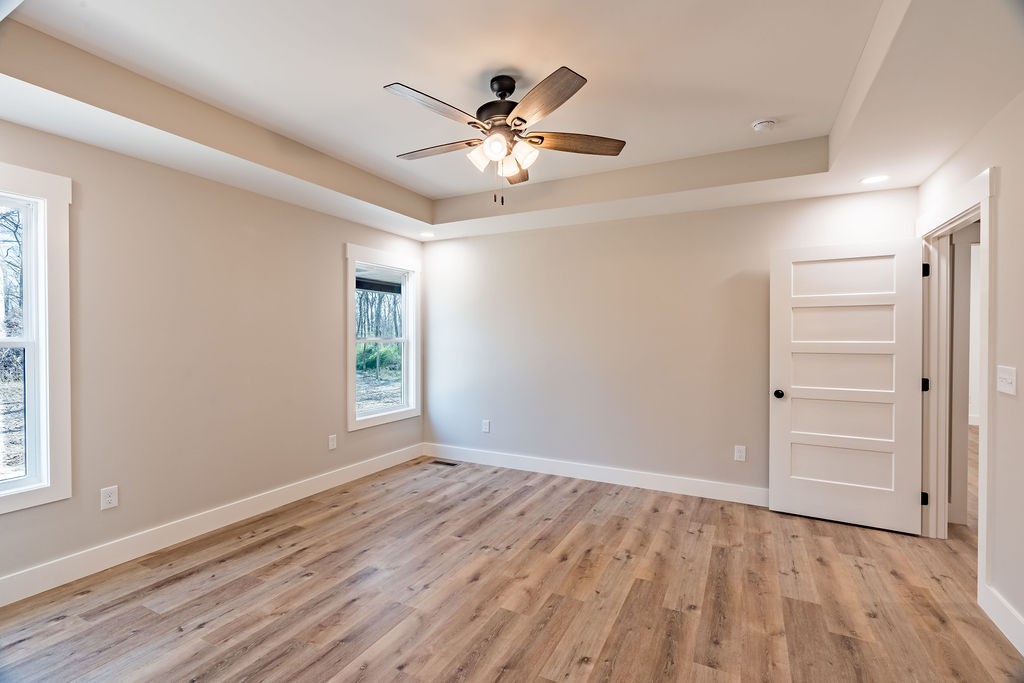 351 Chesnut Road Guthrie, KY 42234 - Photo 11 of 30 a view of empty room with wooden floor and fan