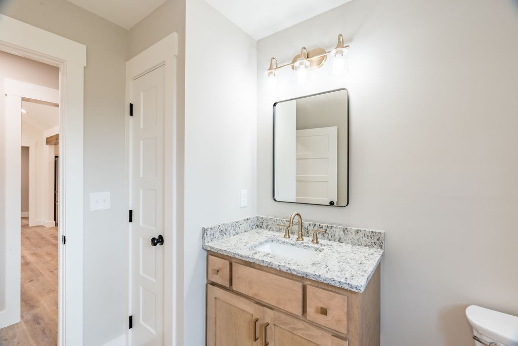 351 Chesnut Road Guthrie, KY 42234 - Photo 22 of 30 a bathroom with a granite countertop sink and a mirror
