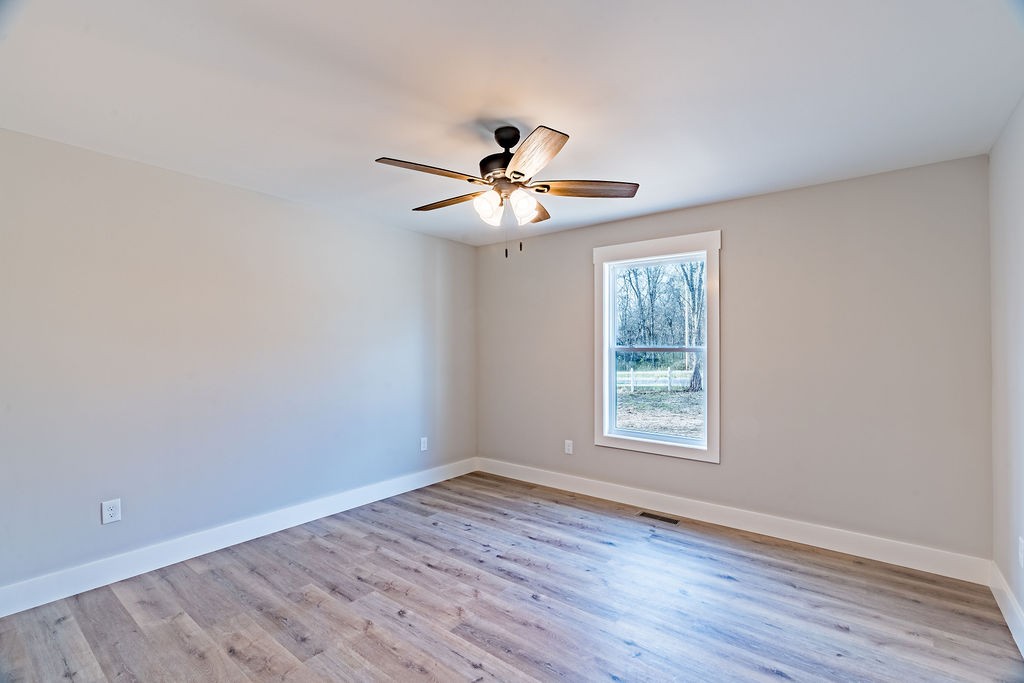 351 Chesnut Road Guthrie, KY 42234 - Photo 23 of 30 a view of an empty room with window and wooden floor