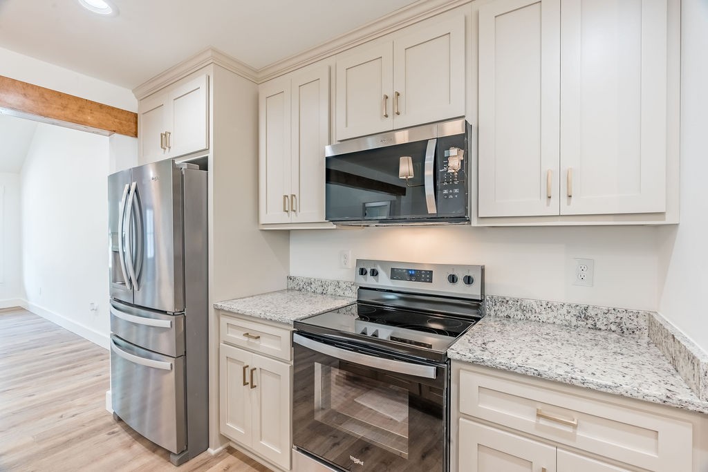 351 Chesnut Road Guthrie, KY 42234 - Photo 7 of 30 a kitchen with stainless steel appliances granite countertop a refrigerator stove and sink