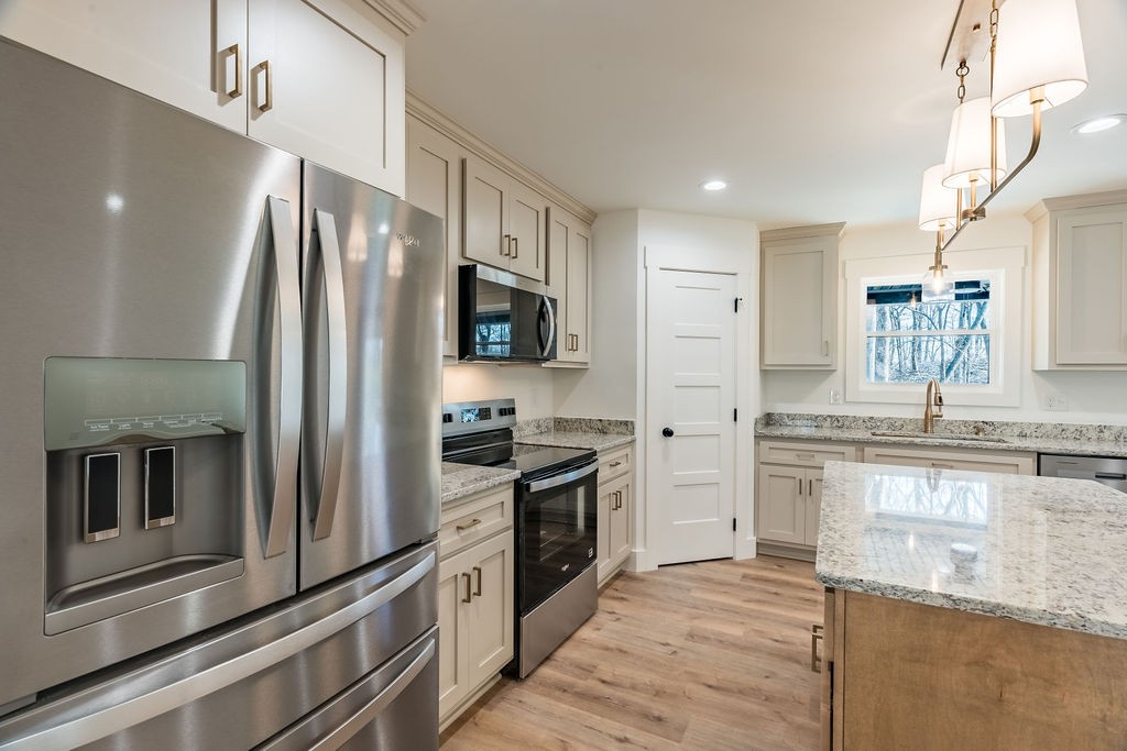 351 Chesnut Road Guthrie, KY 42234 - Photo 8 of 30 a kitchen with stainless steel appliances granite countertop a refrigerator a stove and a sink