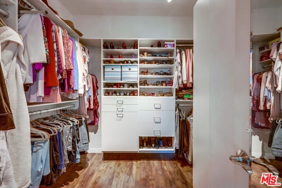 32377 Corte Santa Catalina Temecula, CA 92592 - Photo 15 of 27 a view of walk in closet with clothes and shoes