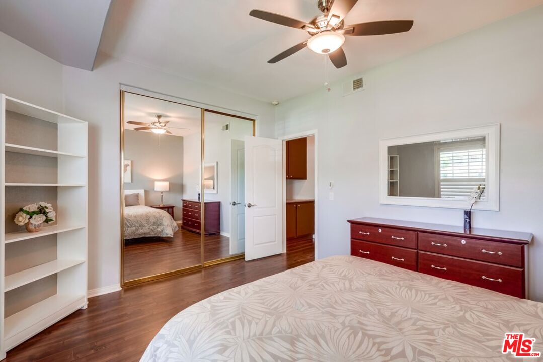 32377 Corte Santa Catalina Temecula, CA 92592 - Photo 18 of 27 a bedroom with a bed and wooden floor