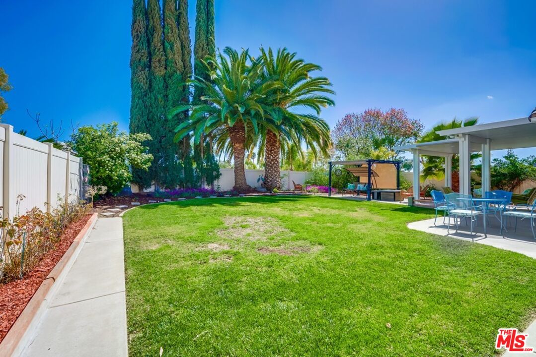 32377 Corte Santa Catalina Temecula, CA 92592 - Photo 20 of 27 a view of a swimming pool with a table and chairs