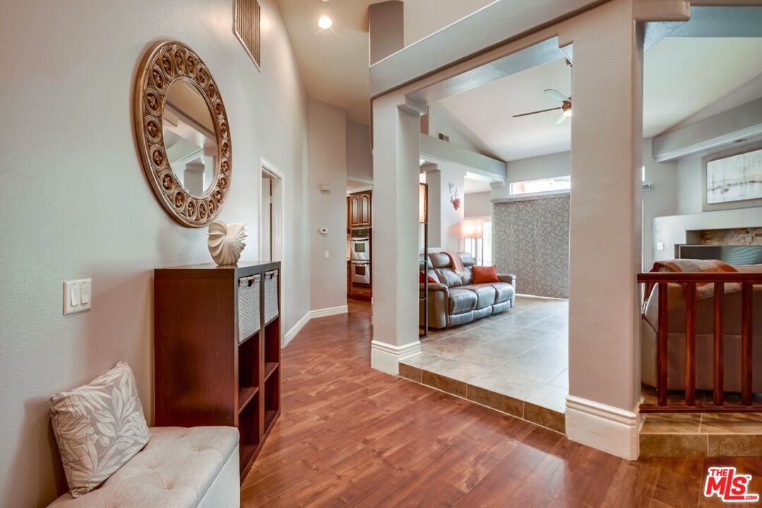 32377 Corte Santa Catalina Temecula, CA 92592 - Photo 3 of 27 a view of a hallway with workspace and a living room