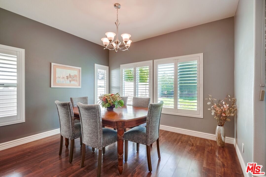 32377 Corte Santa Catalina Temecula, CA 92592 - Photo 6 of 27 a view of a dining room with furniture window chandelier and wooden floor