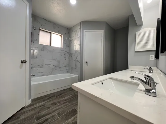 a bathroom with a sink and a bathtub